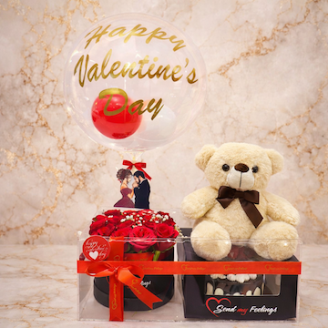 luxury valentine hamper with chocolate cake in acrylic box, 15 red roses black box arrangement, brown teddy bear and bobo balloon romantic surprise gift by Send My Feelings