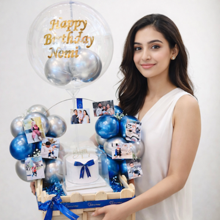 Personalised birthday hamper with photo prints, blue silver balloons, and mini fruit cake in pinewood basket