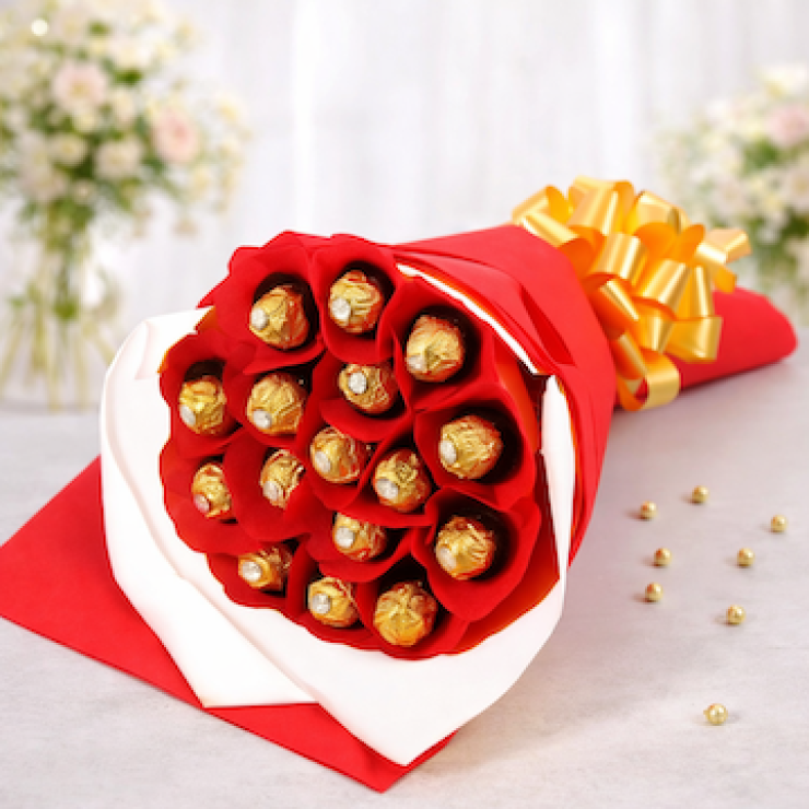16 pcs ferrero rocher chocolate bouquet wrapped in red and white paper tied with golden ribbon luxury gift