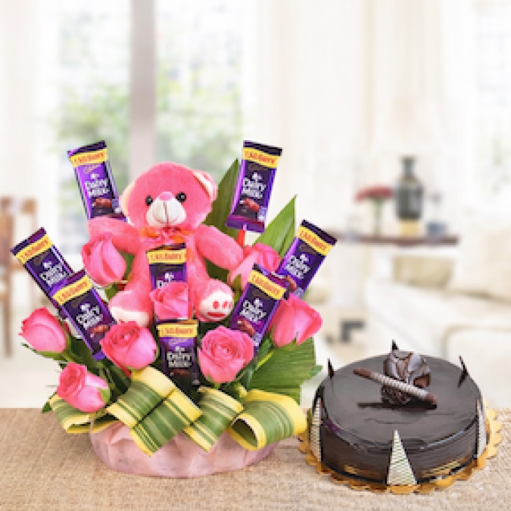 Pink teddy basket with Dairy Milk chocolates and truffle cake gift combo