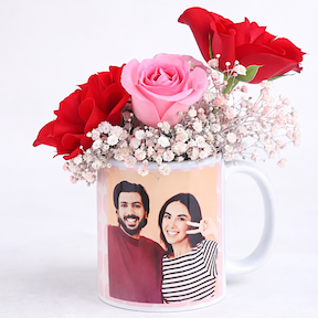 Personalized photo mug filled with red and pink roses and baby breath flowers, romantic floral gift arrangement