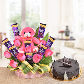 Pink teddy basket with Dairy Milk chocolates and truffle cake gift combo